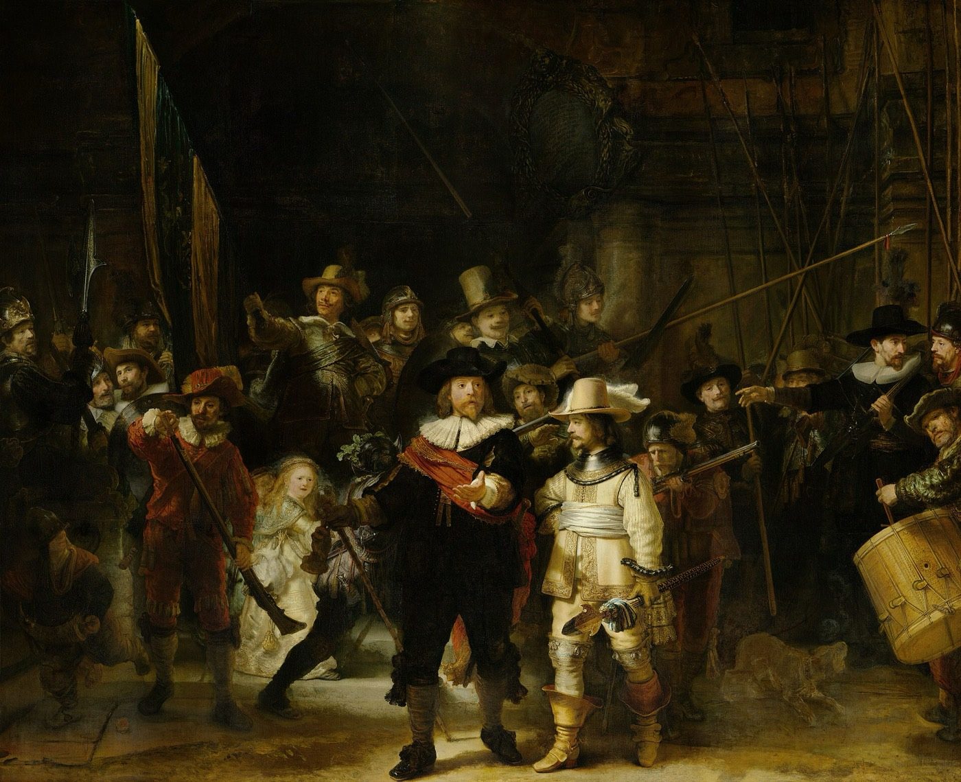 Rembrandt's Night Watch as it hangs today in the Rijksmuseum, showing the militia company advancing out of a dark archway.