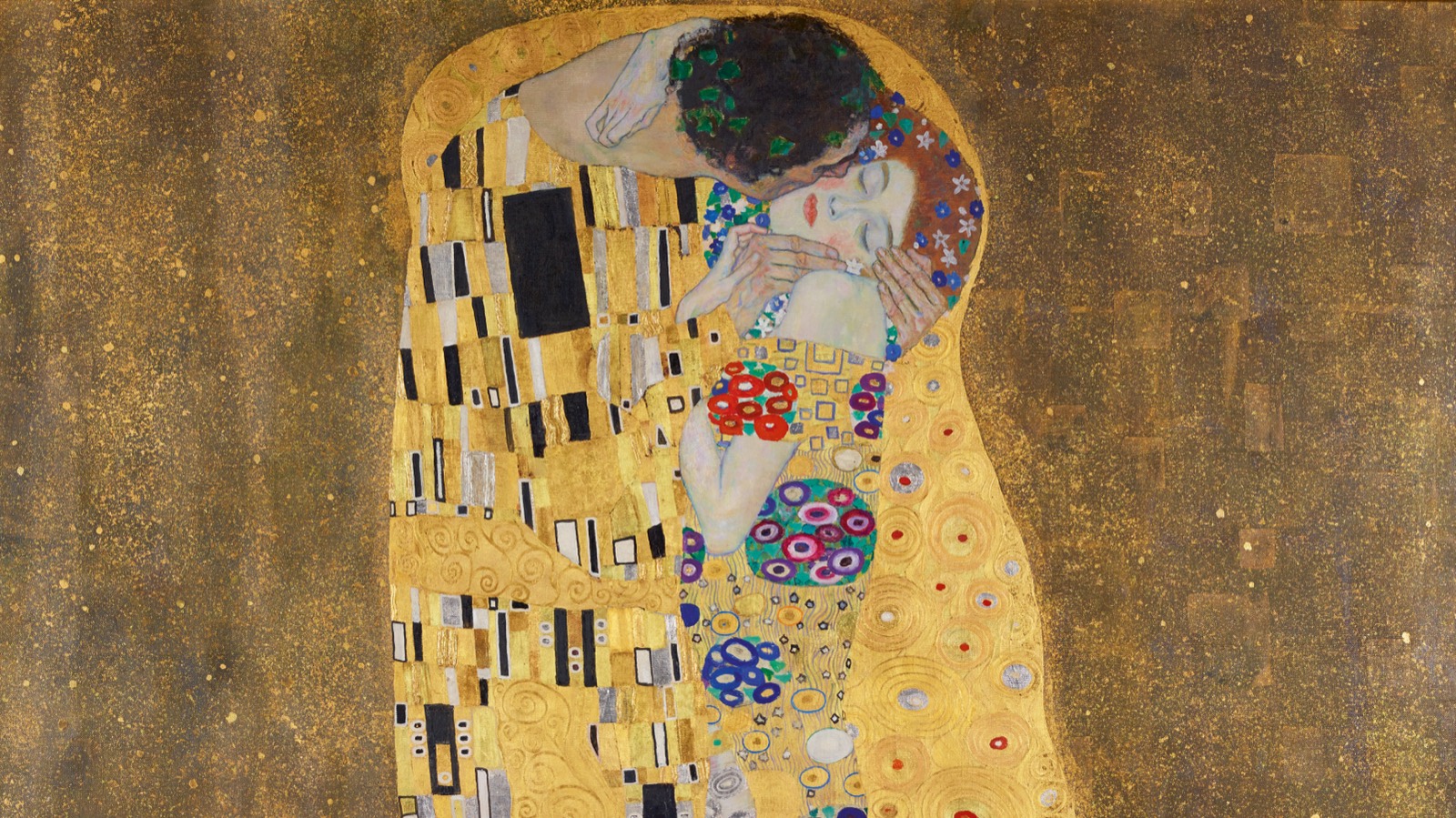 Detail of Gustav Klimt’s The Kiss, showing the two embracing figures against a field of gold
