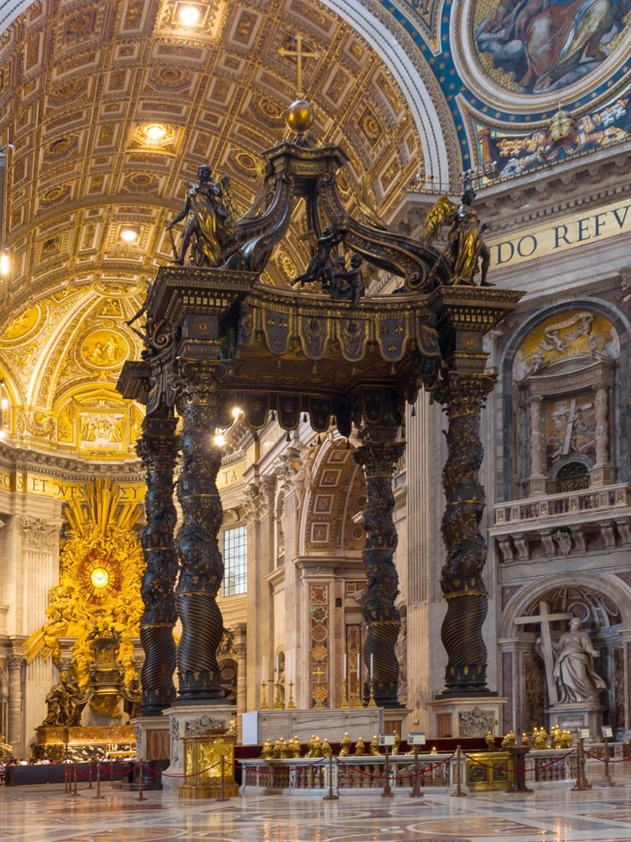 Gian Lorenzo Bernini's bronze baldachin over the high altar of St. Peter's Basilica, standing at the crossing directly beneath Michelangelo and della Porta's dome and marking the tomb of St. Peter below.