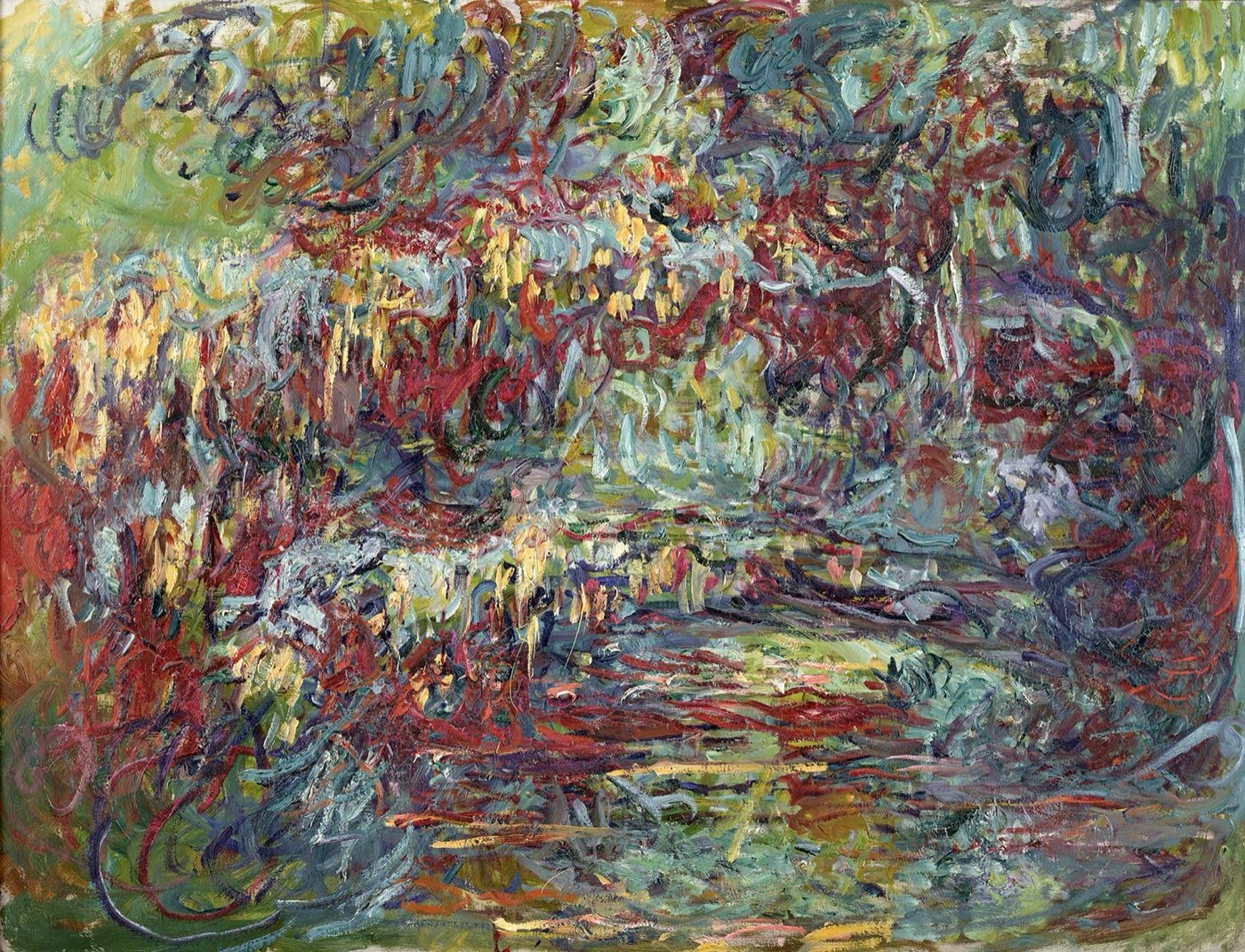 A late Monet canvas of the Japanese bridge painted around 1918 to 1924 in slashing red, orange and green strokes, with the bridge barely legible